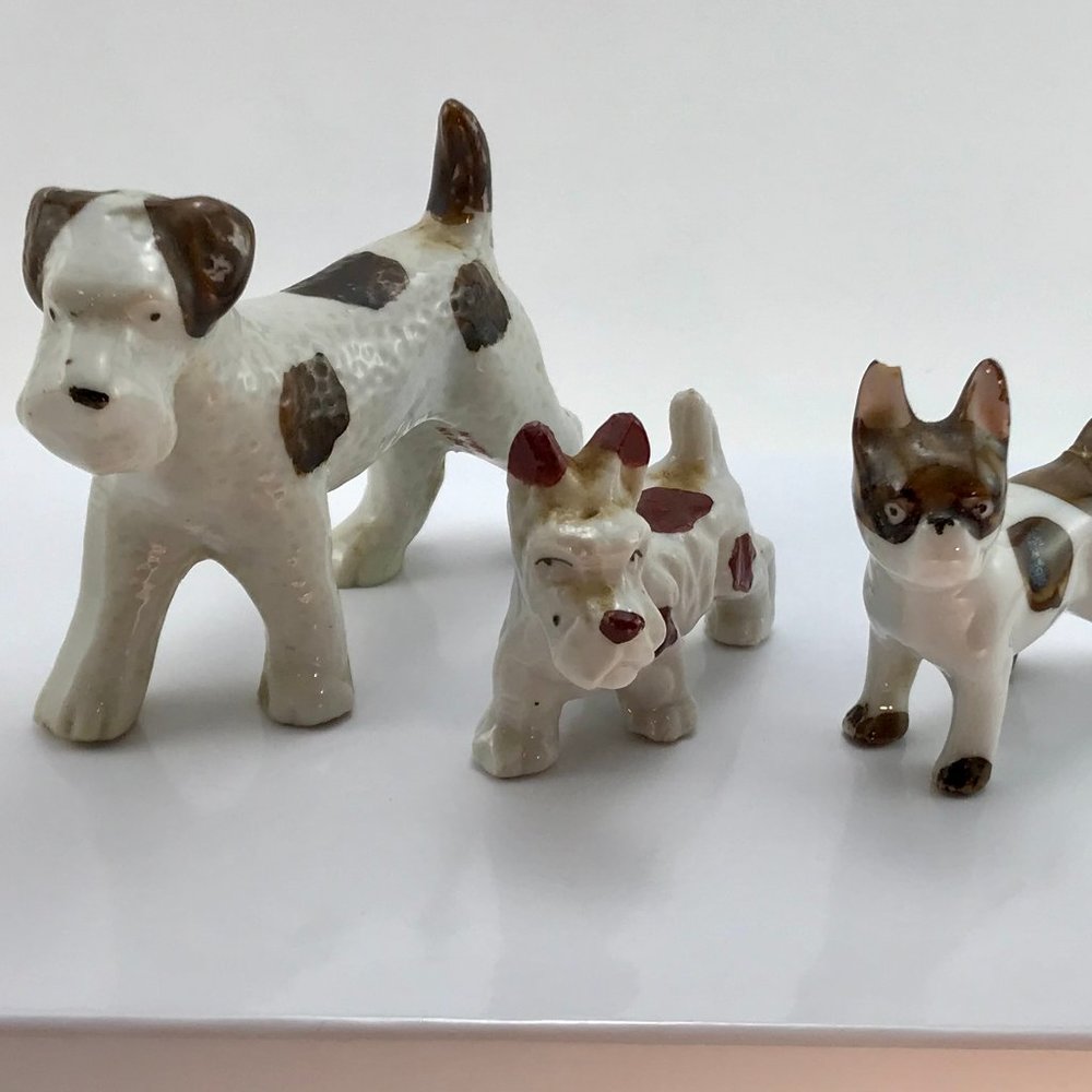 Set of 3 brown & white dog figurines